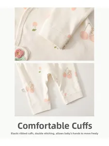 Detail of elastic ribbed cuffs and double-stitched seams on cotton baby romper