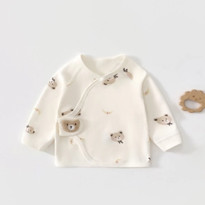 Detail of soft cotton newborn kimono top with cute bear and moon prints and side snaps