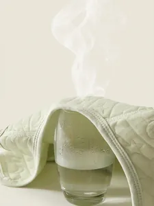 Breathable quilted cotton baby vest showing steam ventilation for superior air flow