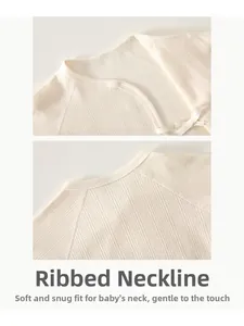 Detail of baby cotton bodysuit featuring ribbed texture with side bow and snap closure