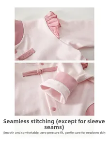 Detail of pink cotton baby romper with Chinese frog buttons and ruffled collar design