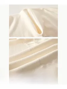 Close-up of seamless boneless stitching and soft ribbed texture on newborn cotton bodysuit