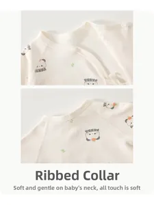 Close-up of baby cotton bodysuit with piped neckline and soft panda print and buttons