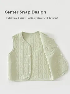 Detail of infant quilted vest showing star pattern stitching and snap button closure