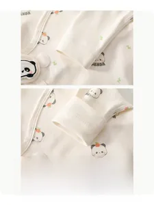Detail view of cotton baby shirt featuring ribbed cuffs and cute panda print pattern