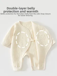 Detail of warm quilted newborn romper with star texture and snap closure for easy diapering