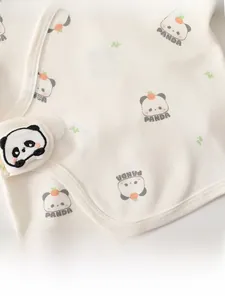 Close-up of cotton baby top featuring 3D panda embroidery and cute orange motifs