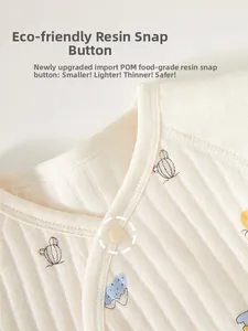 Close-up of baby romper collar featuring eco-friendly POM resin snaps and soft ribbed fabric