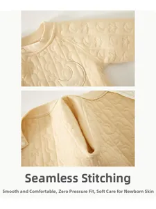 Detail of baby romper featuring seamless stitching and celestial star quilting texture