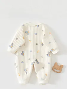 Close-up of baby romper back with ribbed fabric and cute dinosaur patterns
