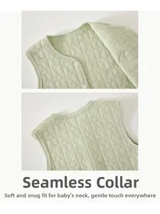 Macro view of baby quilted vest featuring star and moon textures and hemmed neckline