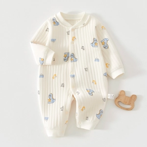 Detail of baby cotton bodysuit with cartoon dinosaur prints and snap buttons