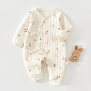 Detailed view of baby romper featuring tulip and rabbit patterns with ribbed cotton fabric
