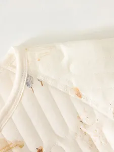 Quilted newborn thermal top with four-needle six-thread flat seams for baby comfort