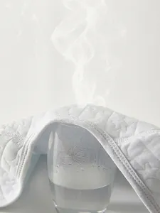 Breathable baby vest fabric with star and heart patterns showing steam ventilation