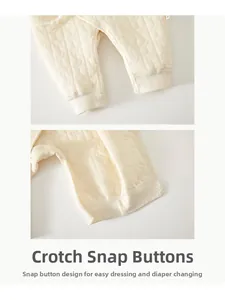 Detail showing the crotch snap buttons on quilted thermal newborn baby romper