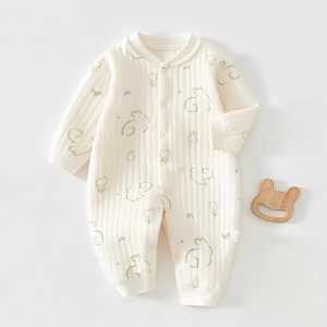 Detailed view of quilted cotton baby romper with cute rabbit prints and snap buttons