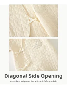 Detailed view of warm quilted newborn romper with side ties and baby moon embroidery
