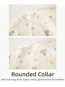 Close-up of baby romper neckline with dinosaur print and soft quilted cotton fabric