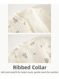Detail of baby romper neckline with snap buttons and cute dinosaur print on ribbed cotton