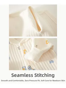Detail of soft ribbed newborn romper with seamless stitching and cute dinosaur print
