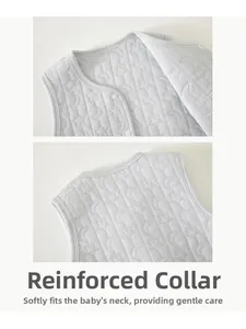 Close-up of quilted star pattern on grey infant vest with high-quality bound neckline