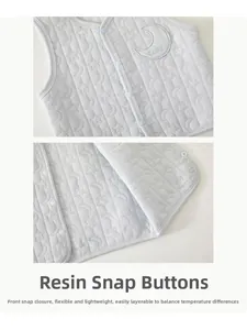 Detail of baby quilted vest featuring star moon embossing and embroidered Baby patch