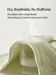 Quilted cotton baby romper in light green featuring breathable and moisture-wicking fabric