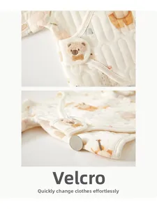 Detail of newborn thermal top with bear embroidery and thick quilted fabric texture
