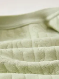 Moisture-wicking breathable cotton fabric with quilted star and moon patterns