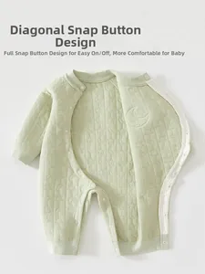 Detail of baby quilted romper with full snap buttons and moon star patterns