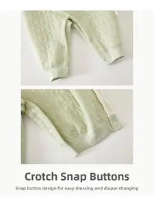 Detail of baby romper snap closure for easy diaper changes and moon star quilted fabric
