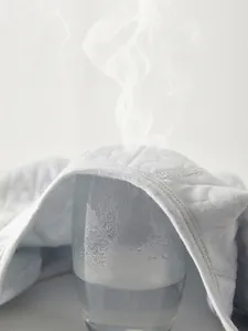 Body matelassé épais pour nouveau-né en bleu clair avec tissu respirant évacuant l'humidité