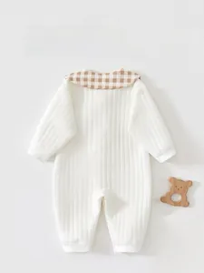 Detail view of the back of a beige cotton baby bodysuit with a brown checkered collar