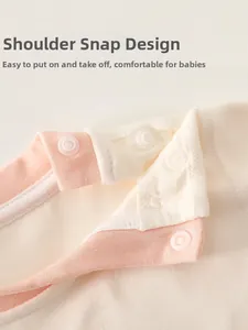 Detail of shoulder snap buttons on cashmere silk infant bodysuit for easy dressing