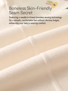 Soft cream baby bodysuit featuring seamless 4-needle 6-thread stitching technology