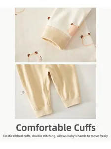 Close-up of elastic ribbed cuffs and double stitching on baby cotton long sleeve outfit
