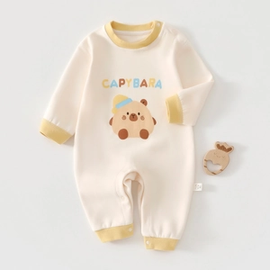 Close-up of baby onesie featuring a cute capybara print and yellow ribbed trim details