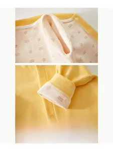Detail of newborn thermal romper featuring maple leaf print and smooth flatlock stitching