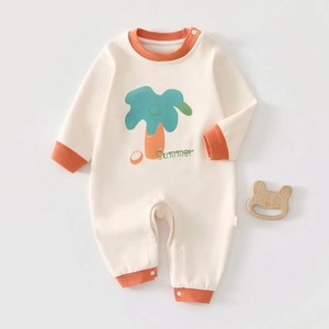 Detail of baby cashmere silk jumpsuit with orange ribbed cuffs and cartoon tree print
