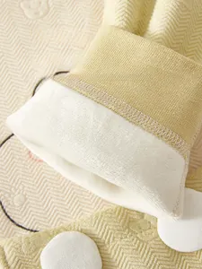 Detail of baby winter jumpsuit showing warm fleece lining and ribbed knit cuffs