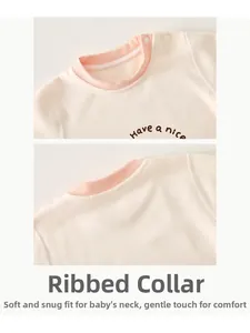 Detailed view of the soft neckline and shoulder buttons on the baby bodysuit