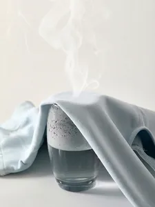 Breathable cotton baby boy set showing steam passing through the striped fabric