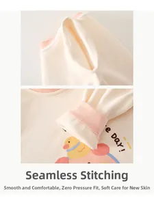 Detail of boneless stitching on baby cashmere silk romper with cartoon duck print