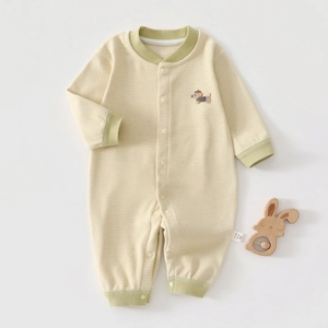 Detail of yellow striped newborn thermal romper with cute dog embroidery and snap buttons
