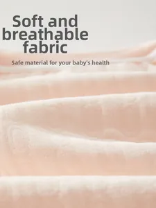 Detailed macro view of pink cotton baby fabric showing soft texture and breathable weave