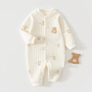 Close-up of ribbed cotton baby romper with bear embroidery and snap button closure