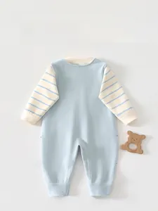 Detail view of the back of a blue baby romper with striped long sleeves in soft cotton
