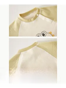 Detail showing the soft bound neckline and snap buttons of the baby winter jumpsuit
