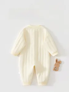 Detailed back view of a quilted cotton baby bodysuit with soft ribbed cuffs and neckline